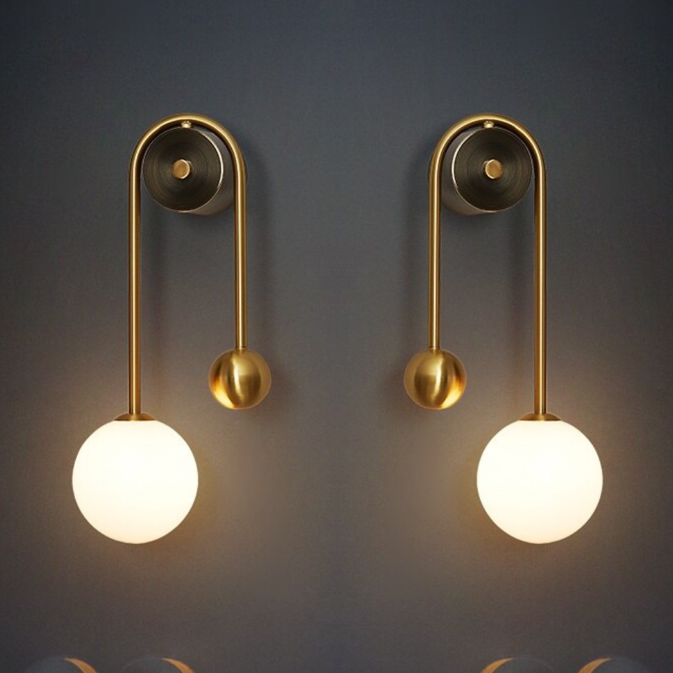Modern Nordic gold wall sconce with glass globe shade