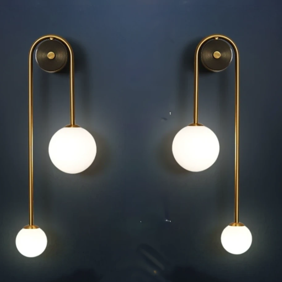 Modern Nordic gold wall sconce with glass globe shade
