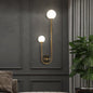 Modern Nordic gold wall sconce with glass globe shade