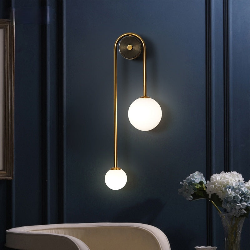 Modern Nordic gold wall sconce with glass globe shade