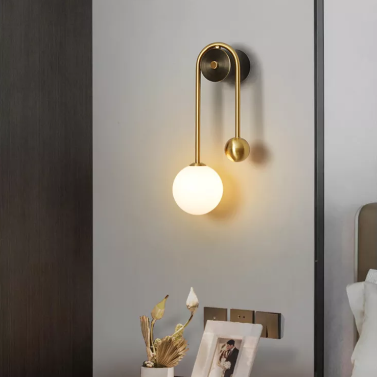 Modern Nordic gold wall sconce with glass globe shade